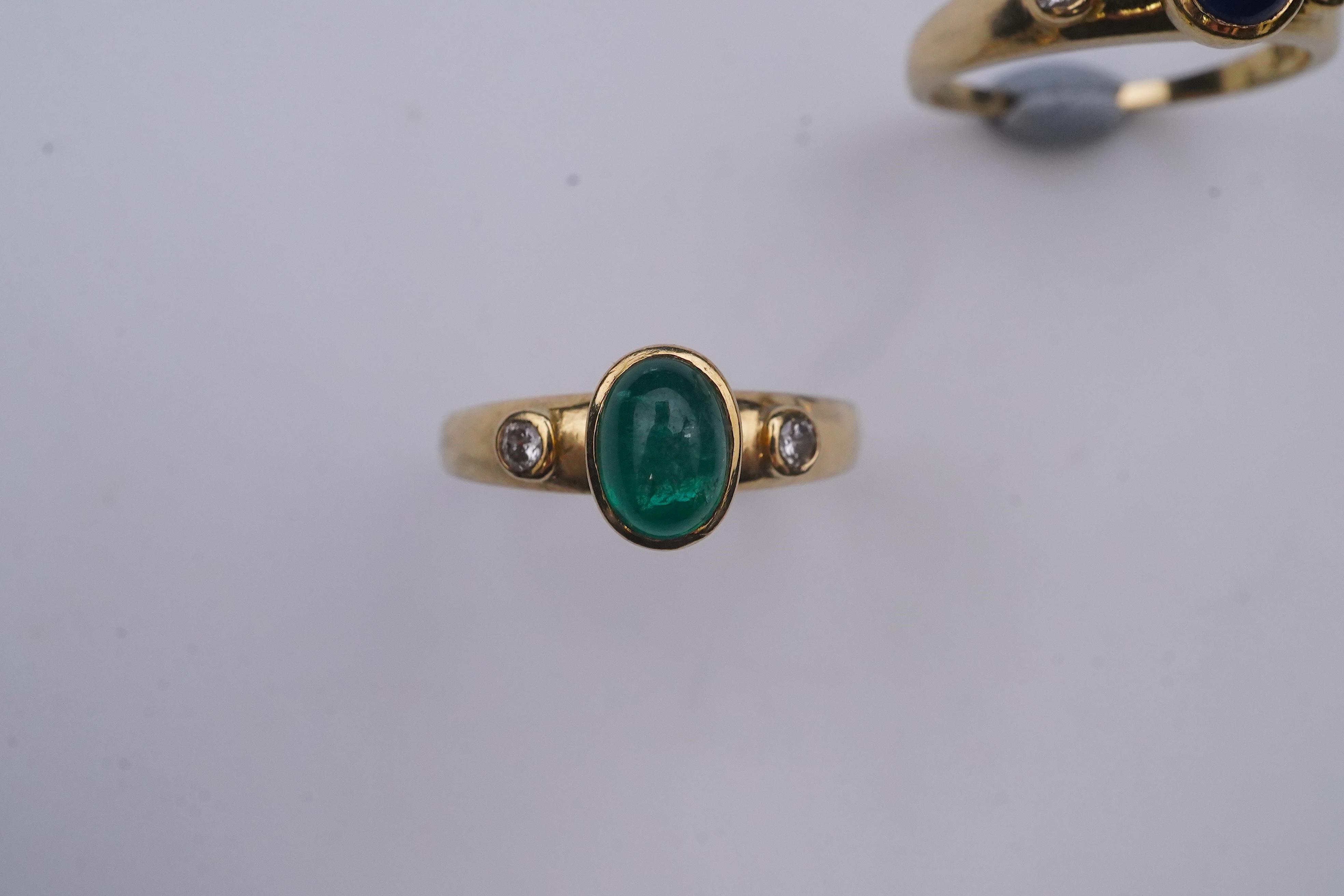 A suite of three gold and gem-set rings